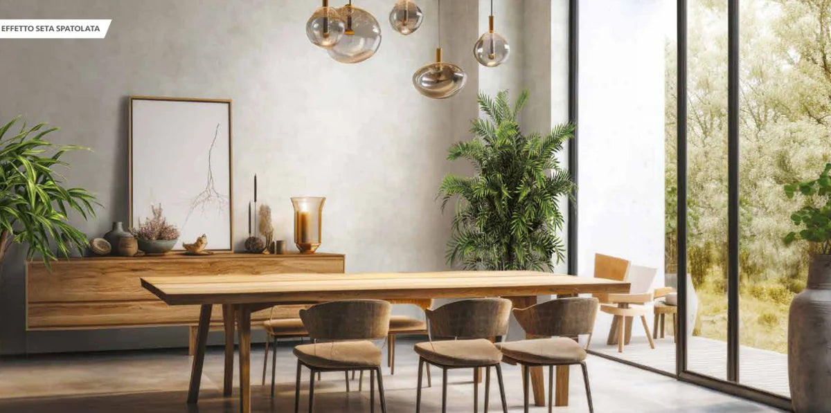 A light-filled dining room with a pale Valsetin 2 decorative wall, from the VALPAINT catalogue.