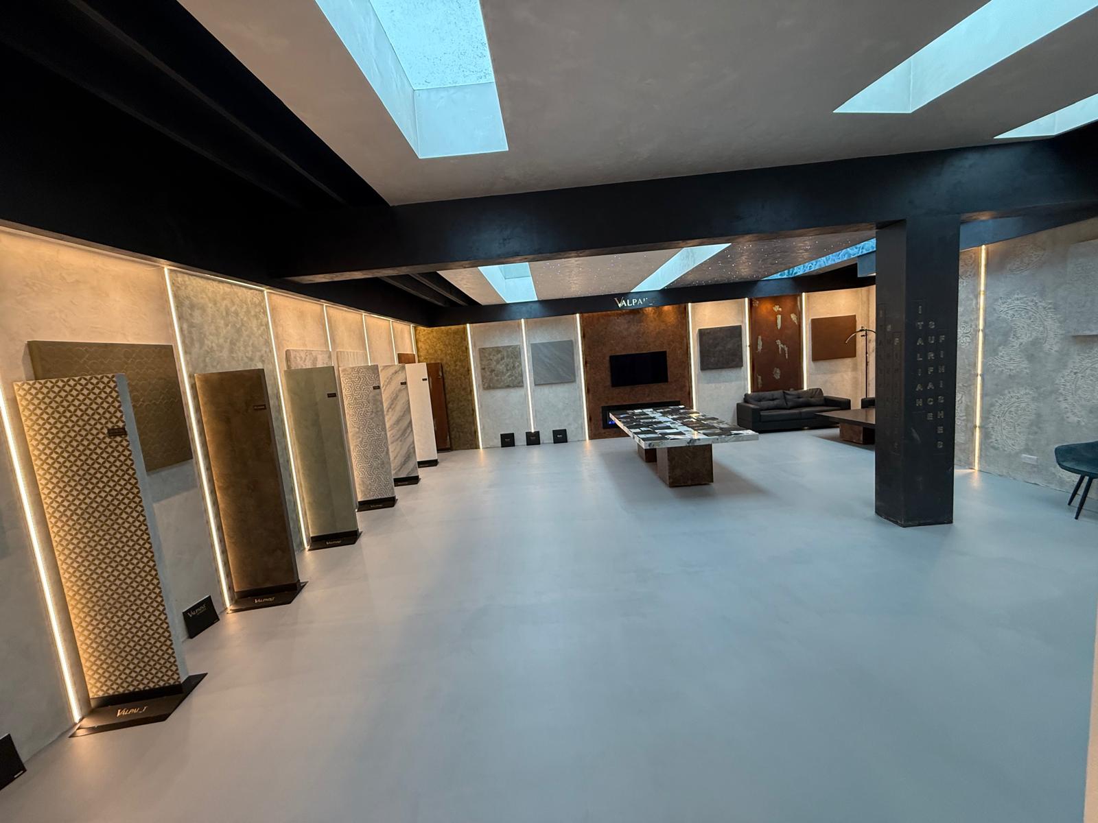 Full-height applied finishes, freestanding material panels and the comparison table inside the ISF London Studio.